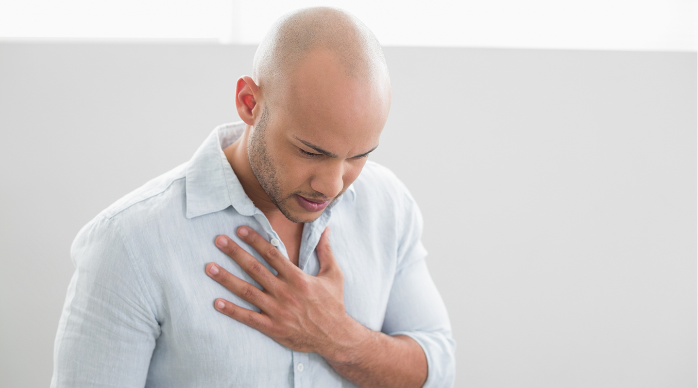 man touching chest