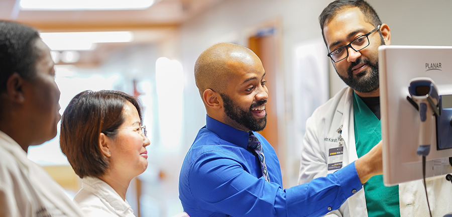 hero healthcare providers at computer