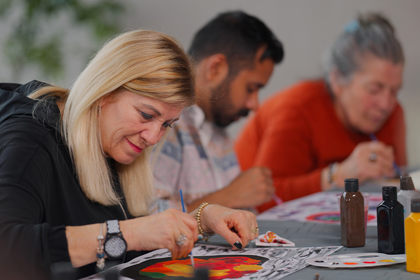 individuals focused on painting